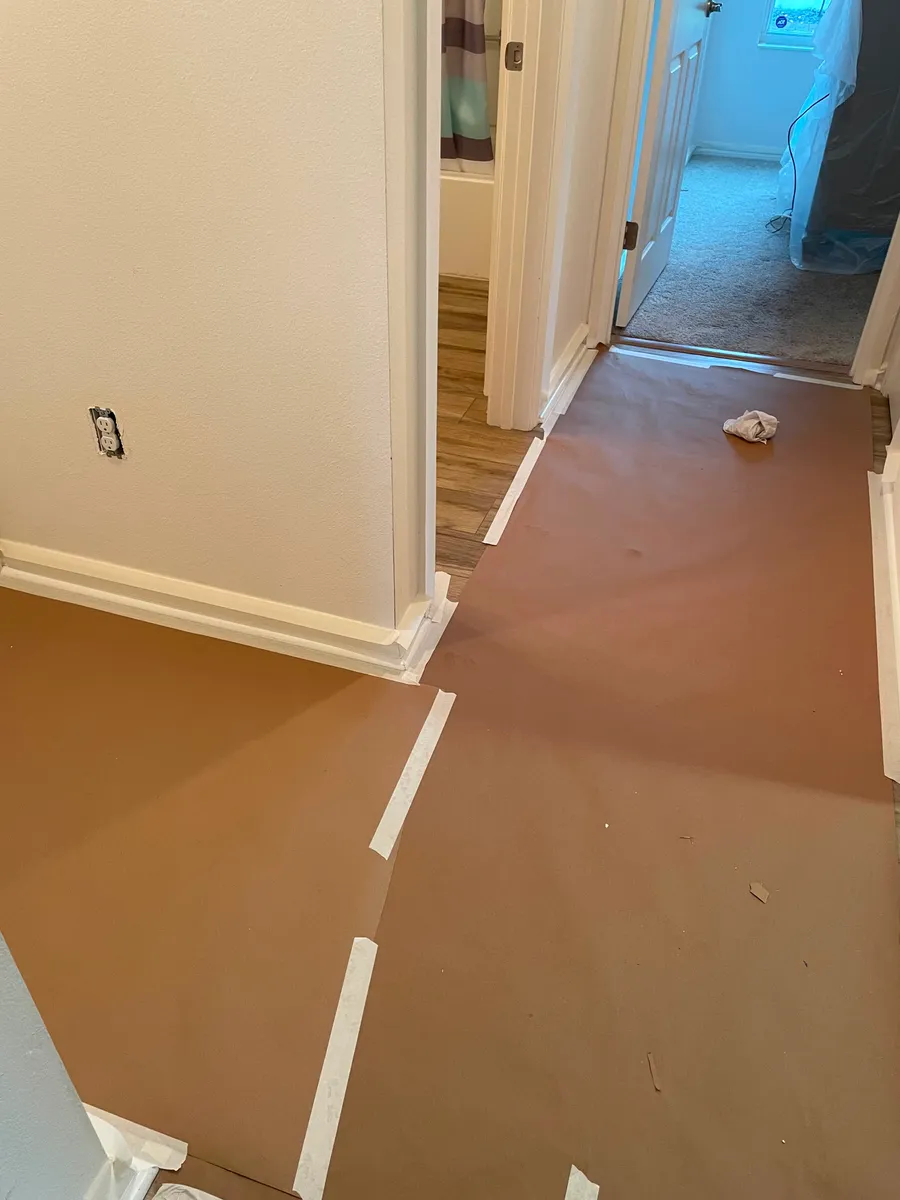 Chris Quality Painting protecting floors before interior painting