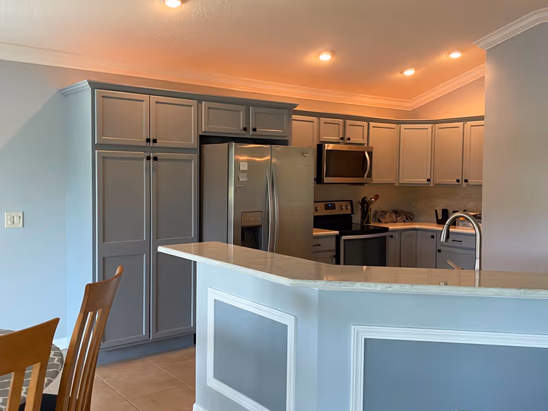 Gray kitchen cabinet painting project with a smooth updated finish