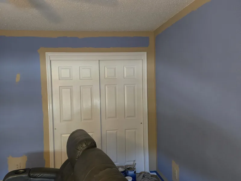 Media room painting progress with protected surfaces