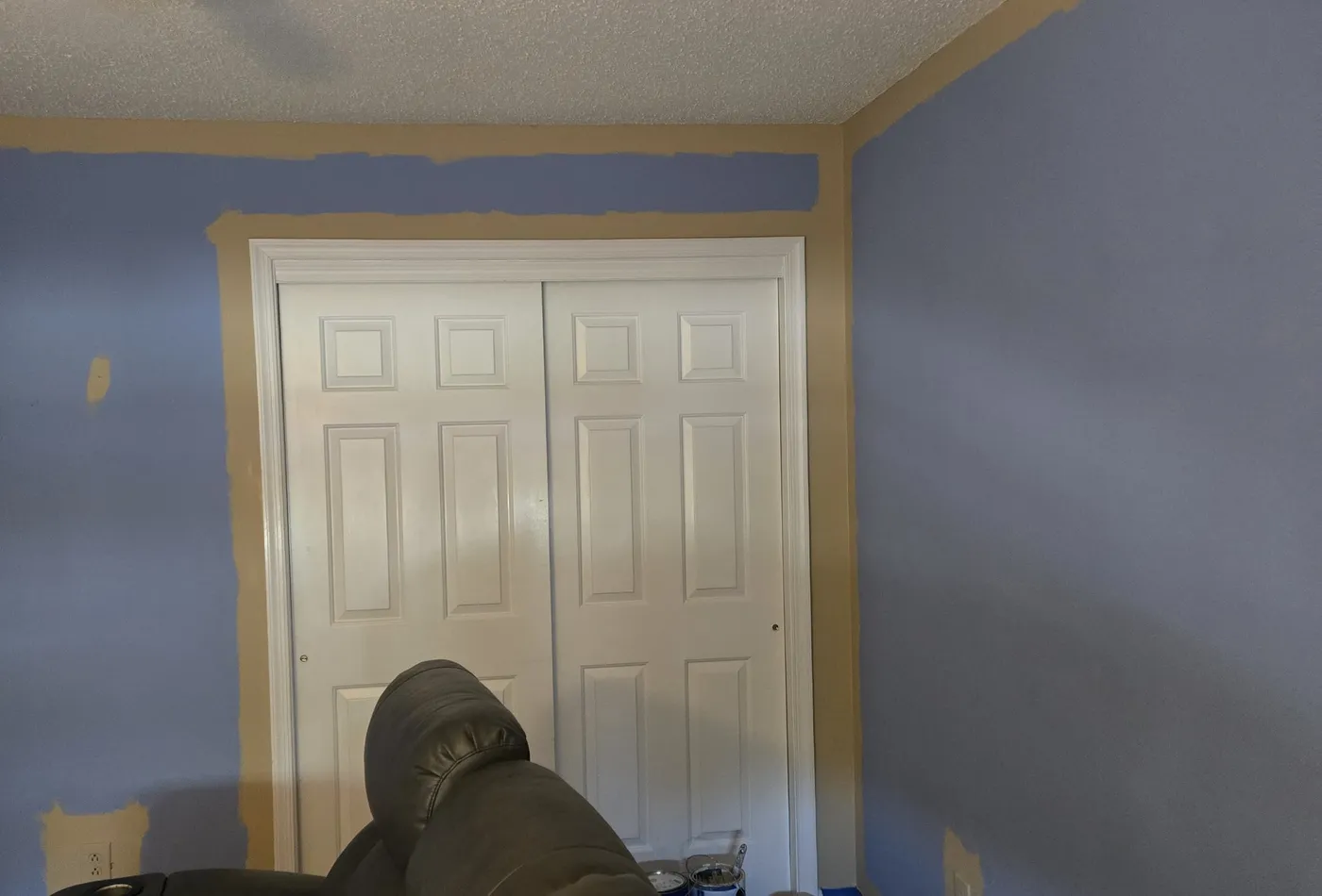 Media room painting progress with protected surfaces