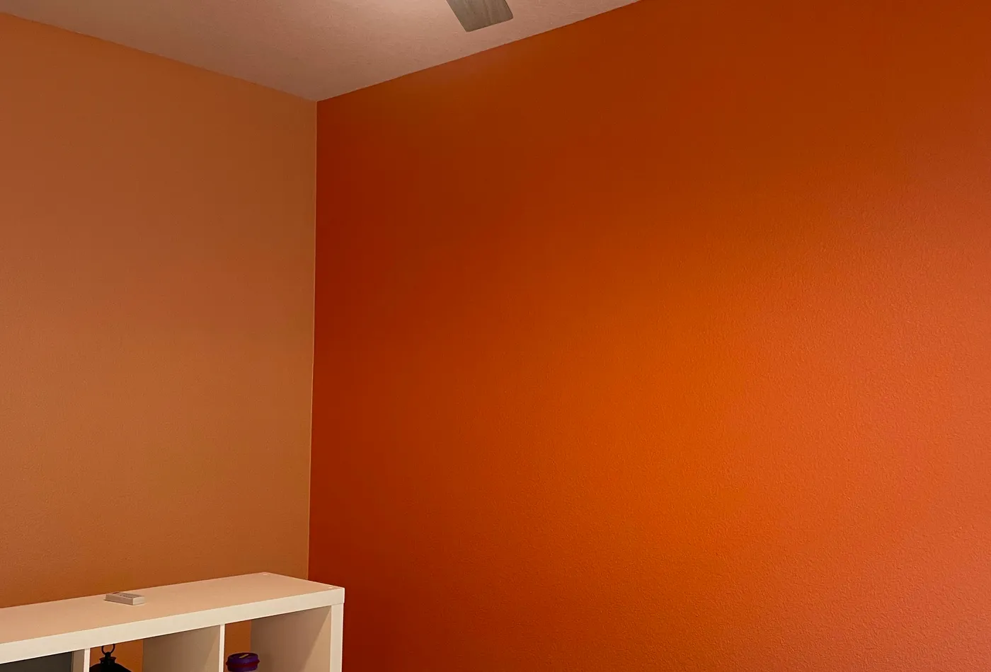 Second view of an orange bedroom accent wall