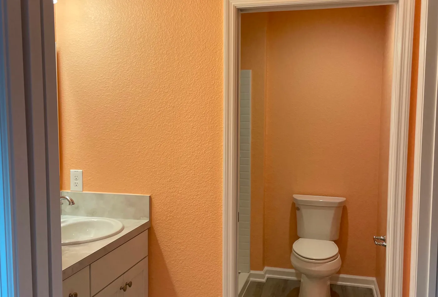 Orange bathroom interior repaint with a clean finish
