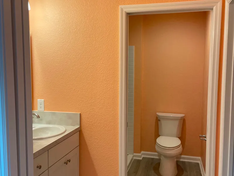 Orange bathroom interior repaint with a clean finish