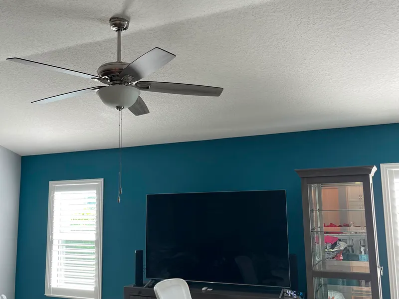 Second view of a teal accent wall in a living room