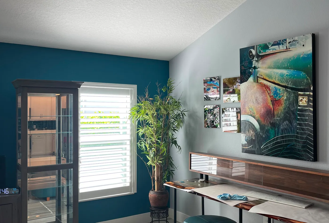 Teal accent wall in a freshly painted living room