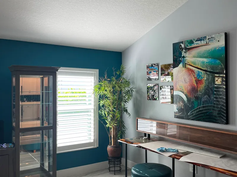 Teal accent wall in a freshly painted living room