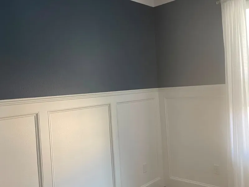 Two-tone wainscoting room with a fresh interior paint finish