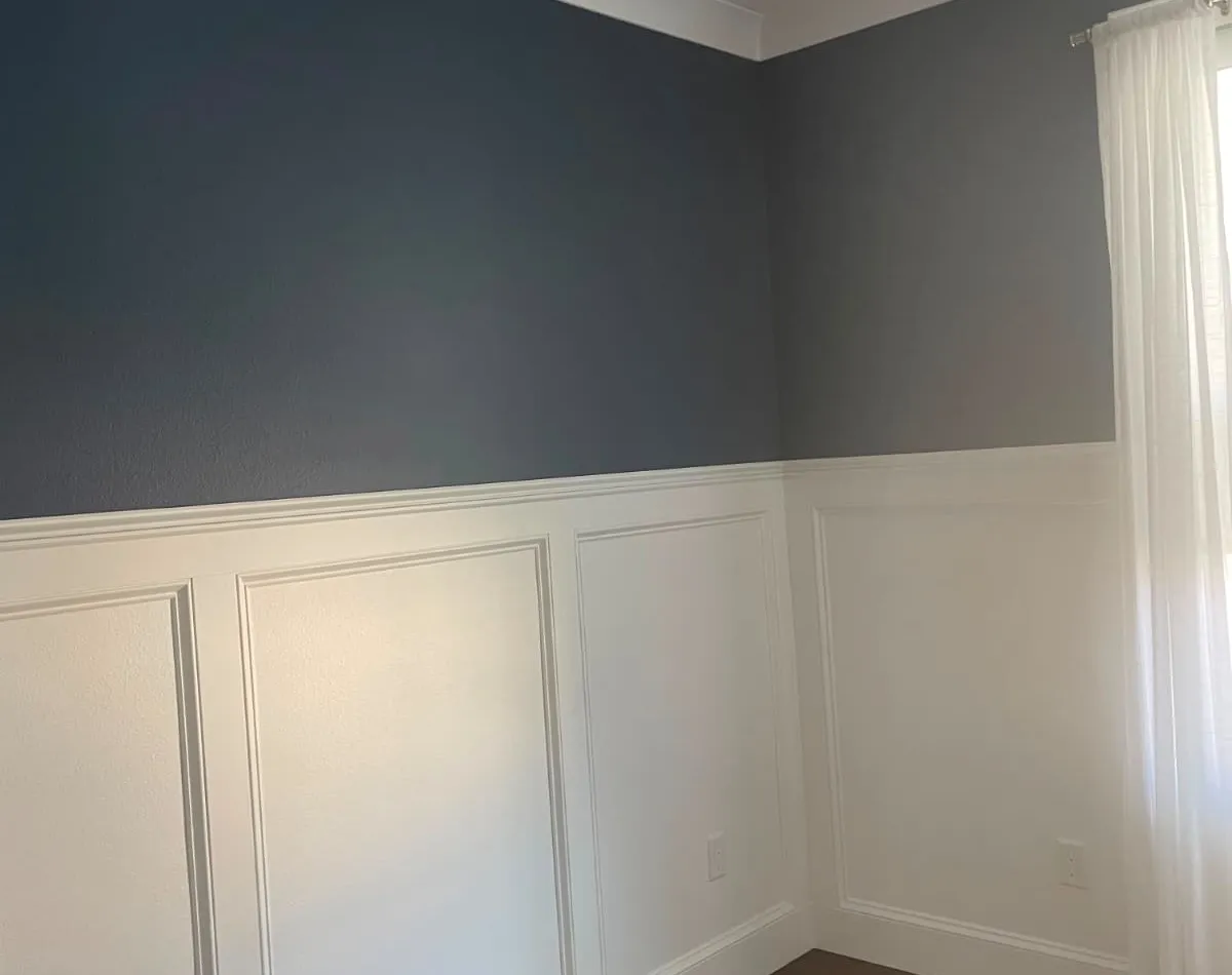 Two-tone wainscoting room with a fresh interior paint finish